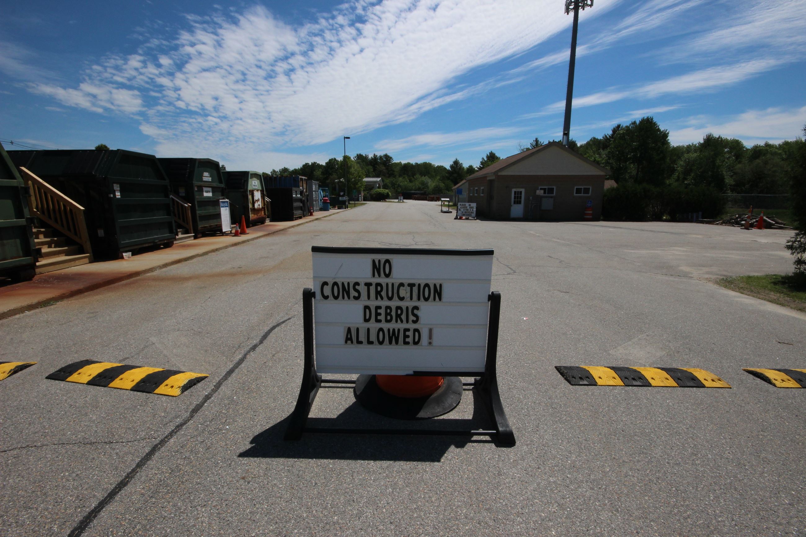 Transfer station road with sign saying no construction debris