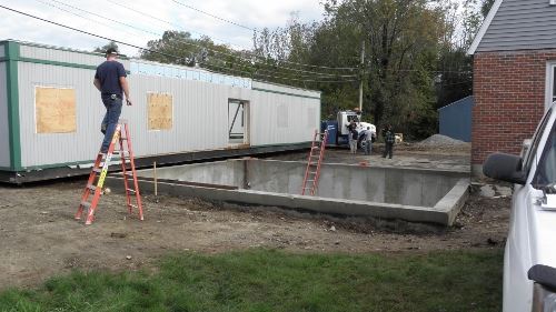 Man on Ladder During Construction